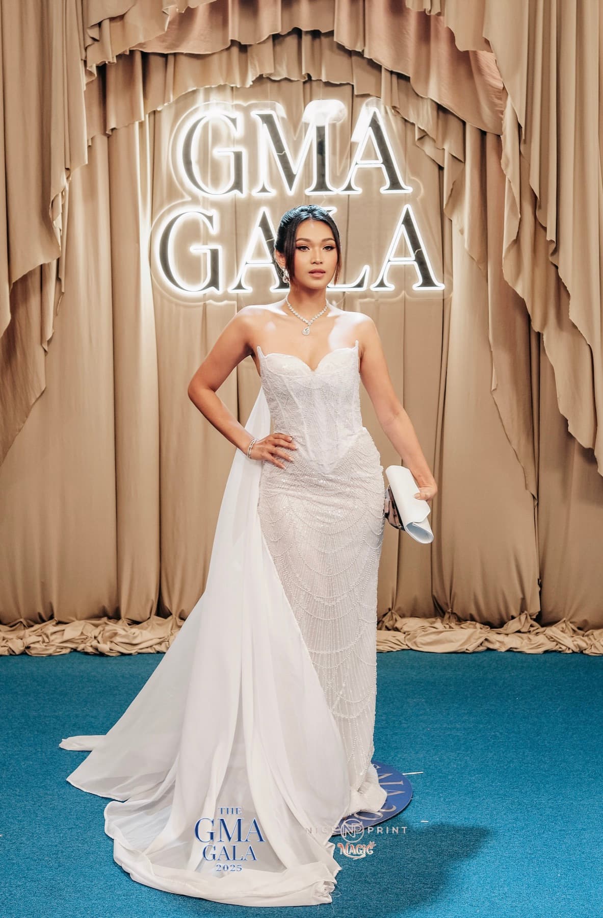 Lyra on the GMA Gala red carpet in a white gown